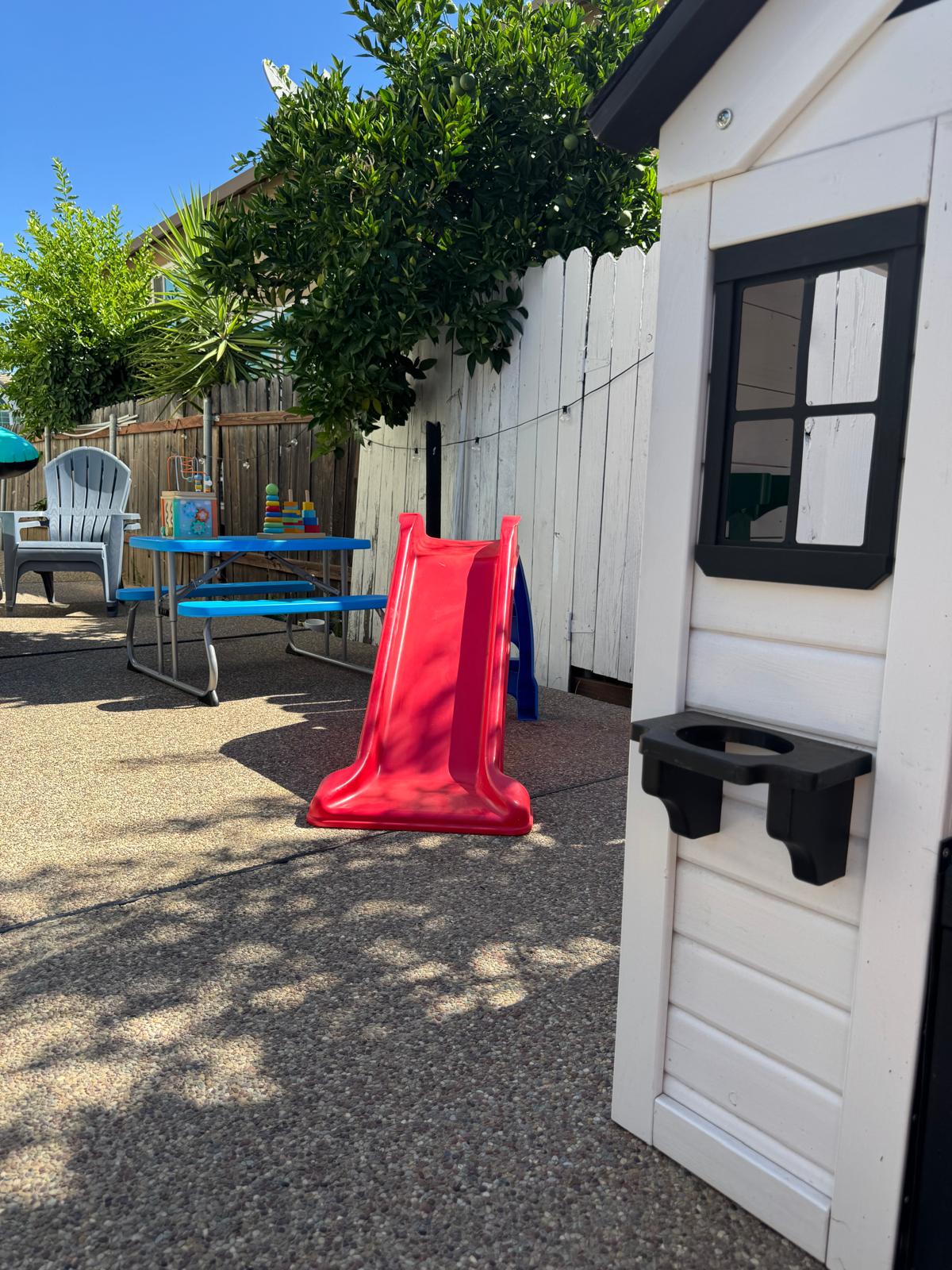 Backyard play area with a slide for active outdoor play