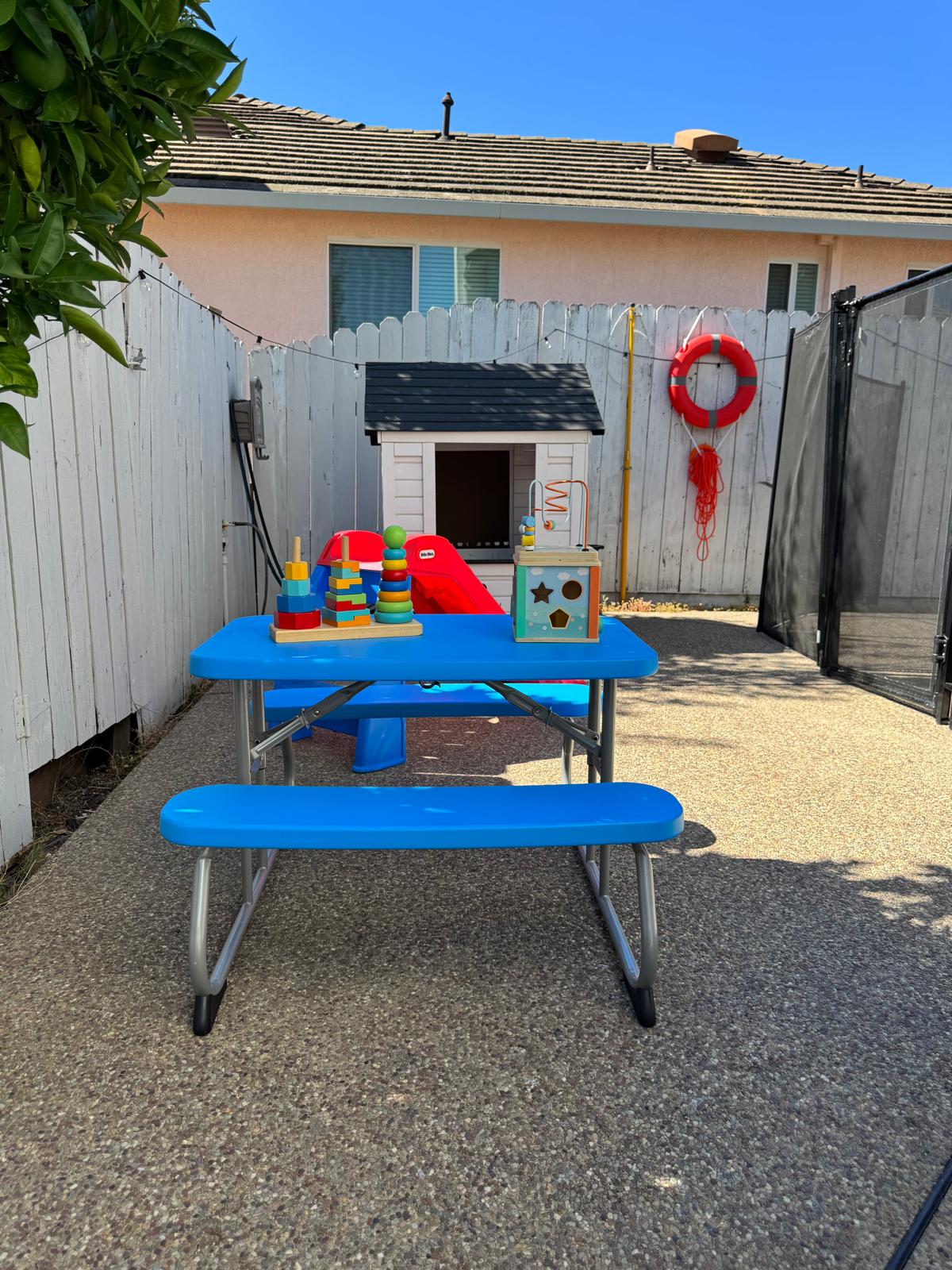 Outdoor picnic table set up with educational toys